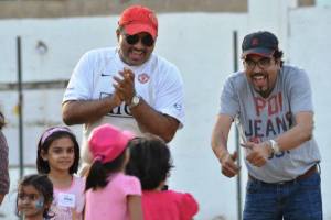 Dads cheer on their daughters at the “Daddy and Me” sports clinic.