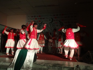 Performers lead a chitrali dance on the first day of the Model Provincial Assembly, Friday, December 20, 2013. 