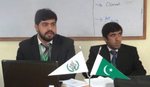 Abdul Rehman and Shadman Sikander, chair and co-chair of the Economics and Finance Committee, address the delegates while they debate about the Privatization of Public Sector Enterprises on Saturday, December 21, 2013. 