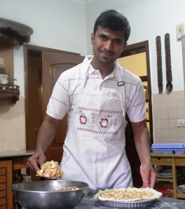 Azhar Zaheer putting the filling in an Apple Pie