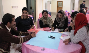 Participants interacting during a group assignment at the workshop