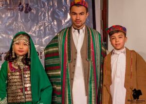 Syed Irfan Haider, a Global UGrad alumnus with two children dressed up in traditional Hazara attire on Day Two of Cultural Diversity Expo on Friday, December 27, 2013.