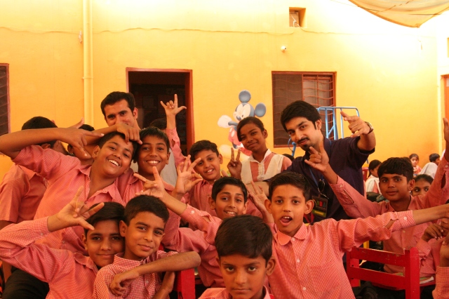 Students from Hope Uplift Foundation all smiles with Global UGrad Alumnus and Discovering New Artists (DNA) Founder Hassan Mujtaba Zaidi on Monday, 28th October, 2013 in Lahore.  “Jeet Key Perhao” Creative Writing Competition aims to provide a platform for students to express themselves creatively.