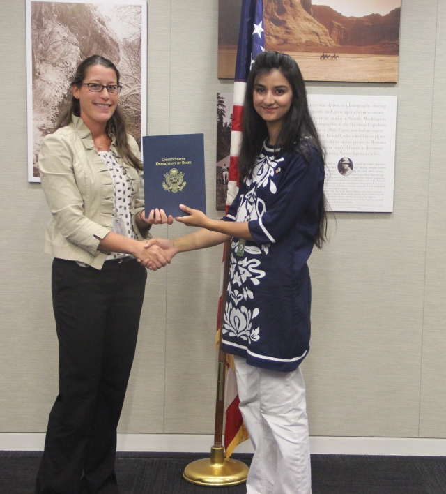 Maham Zahid, SUSI Alumna 2014 receiving certificate on completion of exchange program from Macon E. Barrow, ‎Academic Exchange Specialist at State Department