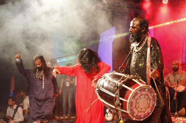 Pappu Saeen drumming the dhol in his unique style accompanied by his band and dancers at Day 2 of Music Mela 2015