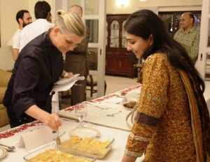 Chef Mary Sue Milliken cutting a piece from the Mexican Dish ‘Enchiladas’