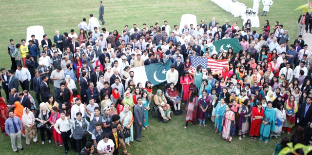 Participants of PUAN Islamabad Chapter Reunion carrying Pakistani and American Flags